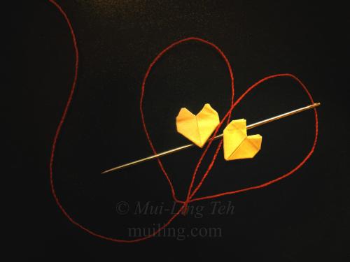 Red String of Fate - miniature origami hearts by Mui-Ling Teh