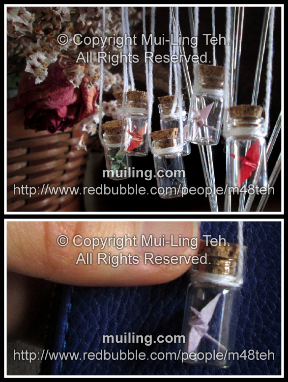 miniature origami cranes in extra small bottles by miniature origami artist Mui-Ling Teh